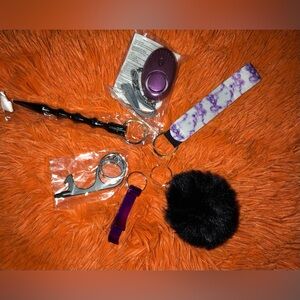 Six piece, self-defense, keychain with black and purple colors